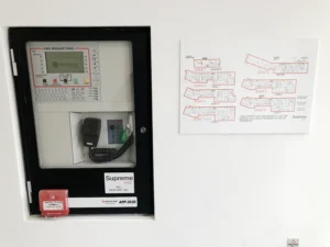 Supreme Fire Solutions Fire Brigade Panel with floor map next to it.
