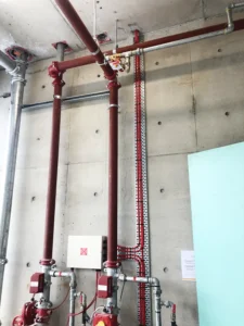 Supreme Fire Solutions red water pipes along the wall